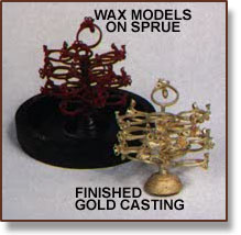 Wax models on sprue and cast rings on sprue after removal from plaster